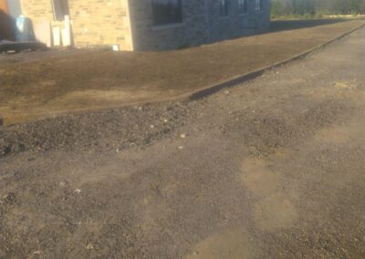 Landscaping in West Yorkshire around suppling and grade topsoil and over seeded.
