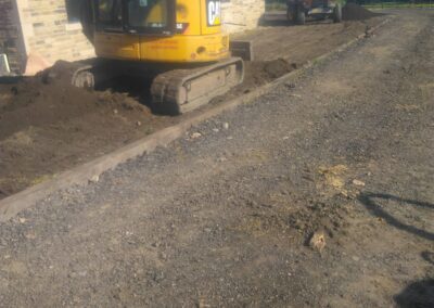 Landscaping in West Yorkshire around suppling and grade topsoil and over seeded.