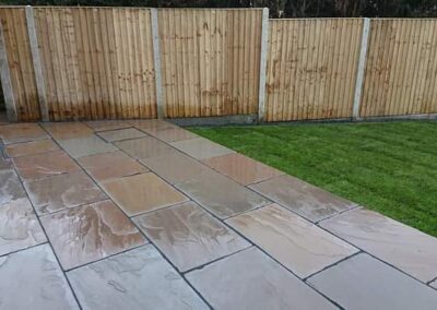 Installation of new fence Indian flags and full garden make over.